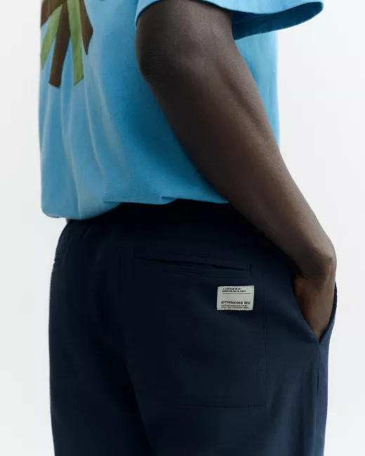 THINKING MU - Travel pants navy en coton bio